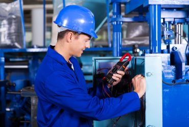 ANASAYFA SLAYT-2- 32755247 - industrial technician examining control box with digital insulation tester
